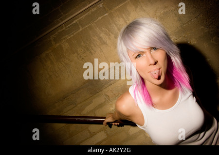 Portrait of woman showing tongue piercing Stock Photo