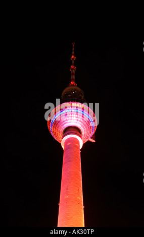Berlin Television Tower colourfully illuminated at night Stock Photo