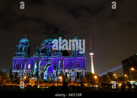 Berlin cathedral colourfully illuminated at night Stock Photo