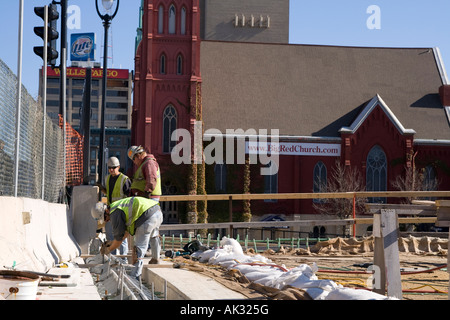construction workers wearing hard hats working Milwaukee Wisconsin Stock Photo
