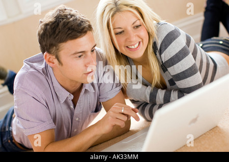 Couple browsing web using laptop Stock Photo