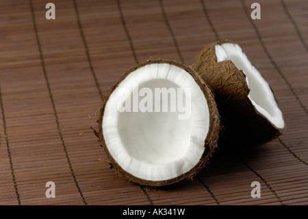 Coconut cracked in two halves Stock Photo