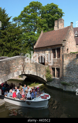 Canal and boat trip in the old town by St Bonifaciusbrug, Arantspark, Bruges, Belgium Stock Photo