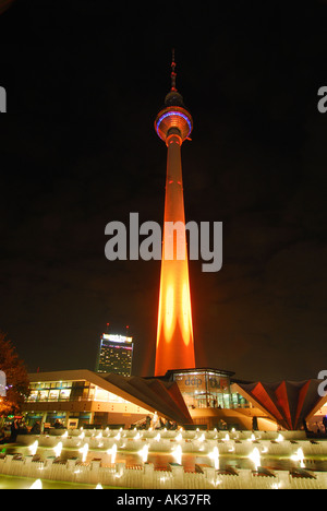 Alexanderplatz Television Tower colourfully illuminated at night, Berlin Stock Photo