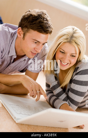 Couple browsing web using laptop Stock Photo