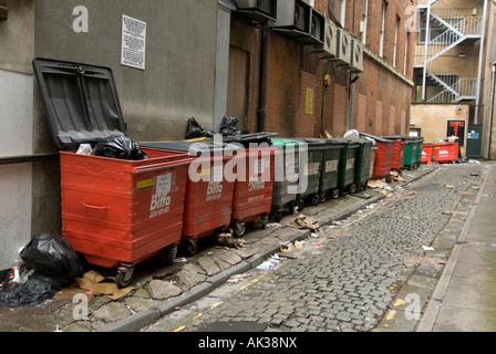 rubbish containers in a street in birmingham used as commercial bins Stock Photo