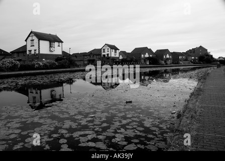 canal front at dudley port in dudley shot in black and white a new housing estate built on old industrial ground for regeneratio Stock Photo