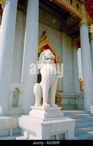 Bangkok Thailand - A Singha statue guarding the entrance to Wat Benchamobophit, Bangkok,  built entirely of white Carrara marble from Italy in 1899 Stock Photo