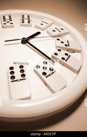 Dominioes on Clock Stock Photo