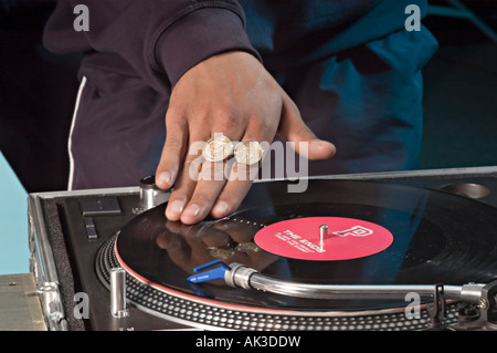 a dj mixing records on some decks Stock Photo