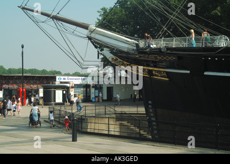 Greenwich bow of the Cutty Sark with entrance to Greenwich Pier for River Thames transport and tour boat excursions London England UK Stock Photo