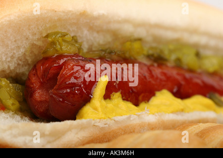 Hot dog Hotdog with mustard sausage fast finger food with French Sub rolls in the street fastfood nobody closeup display overhead from front  hi-res Stock Photo