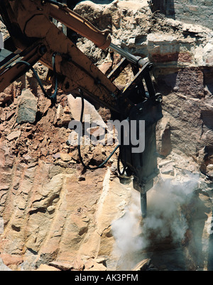 Industry. Construction site excavation.  Hammer Drill breaking up bedrock for building foundation. Stock Photo