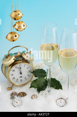 Antique watches showing almost 12 hours and two glasses of champagne Stock Photo