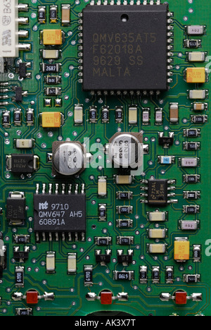 Microchips and electronics on an telephone printed circuit board Stock Photo