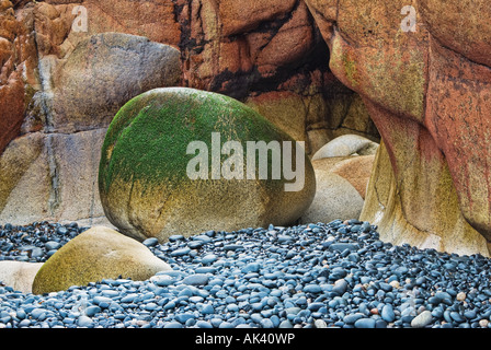 contrasting rocks on cornish beach england uk Stock Photo