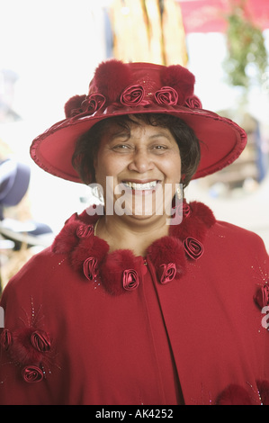 Portrait of a senior woman wearing a fancy red hat Stock Photo