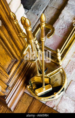 Brass Bucket of Fire Utensils Stock Photo