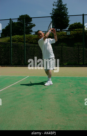 Tennis player about to serve Stock Photo