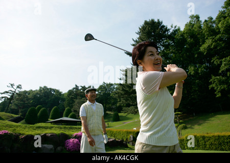Mature couple playing golf Stock Photo