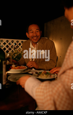 Man having dinner with friends Stock Photo