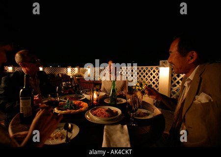 Four adults having dinner Stock Photo