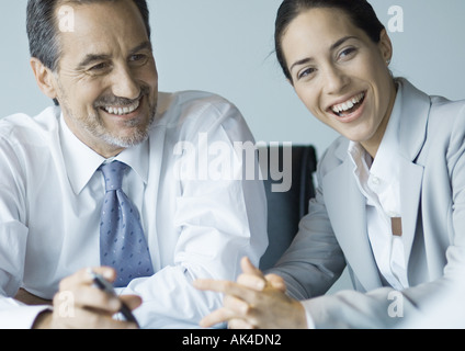 Business colleagues working together, smiling Stock Photo