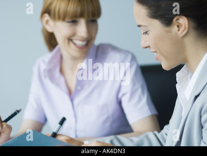 Business colleagues working together, smiling Stock Photo