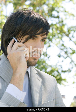 Young businessman using cell phone Stock Photo