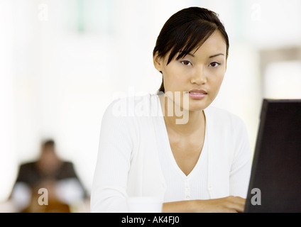 Young woman using laptop Stock Photo