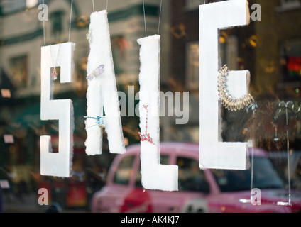 Sale sign in shop window Stock Photo