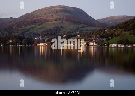 The lights of Ambleside reflected in the still waters of Lake Windermere Stock Photo