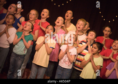 Young singers appear in a dance shool production uk Stock Photo
