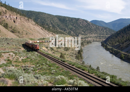 Canadian Pacific Locomotive hauls a freight train along the Fraser ...