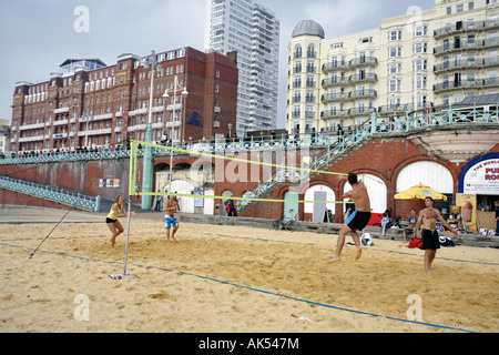 Beach volleyball being played on Brighton Beach, England Stock Photo