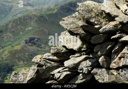 Stone wall on the way from Grasmere lake to Alcock Tarn Cumbria UK Stock Photo