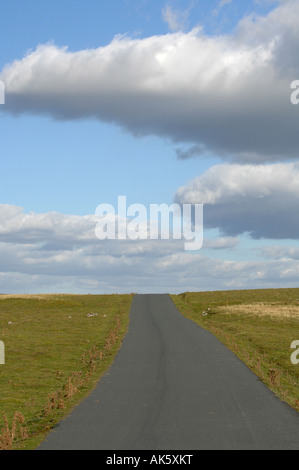Remote road through barren countryside in Upper Teesdale in the North Pennines in County Durham England Stock Photo