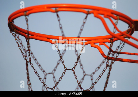 Detail of a baskeball hoop and chain net in a park  Stock Photo