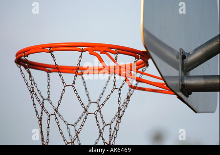 Detail of a baskeball hoop and chain net in a park  Stock Photo