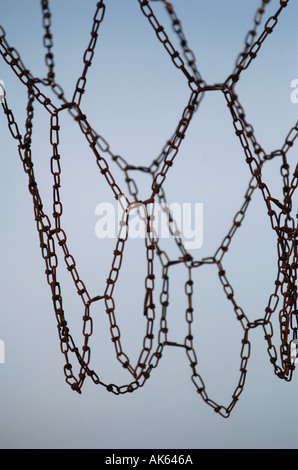 Detail of a baskeball hoop and chain net in a park  Stock Photo