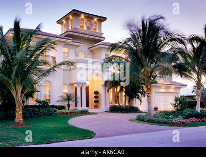 Mediterranean style home exterior at dusk Stock Photo
