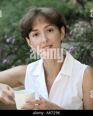 Beautiful mature woman with a cup of coffee Stock Photo