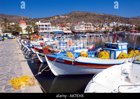 Colorful fishing boats in the harbour of the seaside village of Elounda Crete Greece Stock Photo