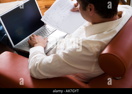Man Working on Laptop in Modern Living Room