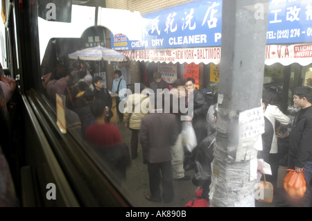 Chinatown from a window bus Manhattan New York City USA colour color Stock Photo