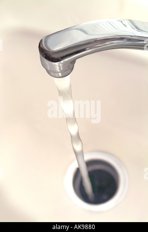 Close up of stream of water and faucet Stock Photo