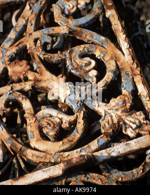 Old decorative ironwork with peeling paint Stock Photo
