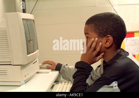 Student age 11 working on computer at the Youth Express After School Program. St Paul Minnesota USA Stock Photo