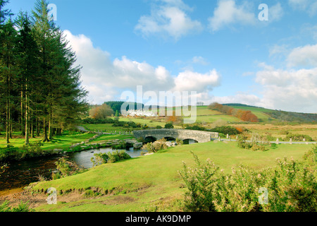 View over Bellever villlage on Dartmoor National Park in the autumn with the road bridge crossing the East Dart river Stock Photo