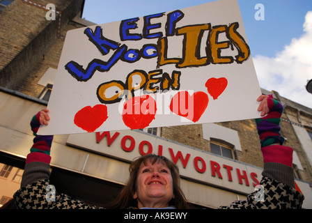 51 year old local woman outside Woolworths on Portobello Road London UK demonstrating to keep their local branch open Stock Photo
